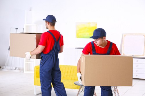 Professional movers handling furniture for storage in Stockwell