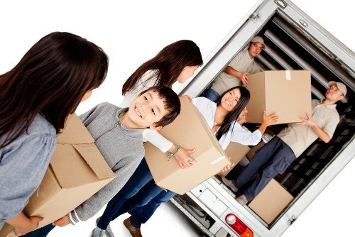 Professional movers handling office furniture