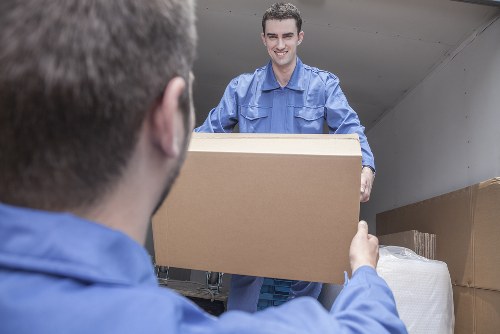 Professional team performing furniture pick-up in Storage Stockwell
