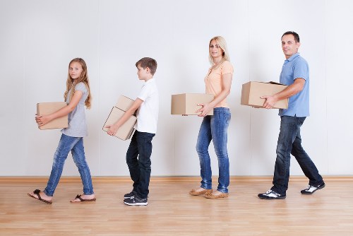 Professional movers handling furniture